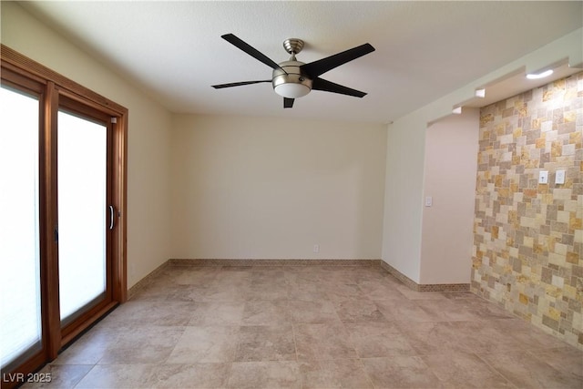 spare room with ceiling fan