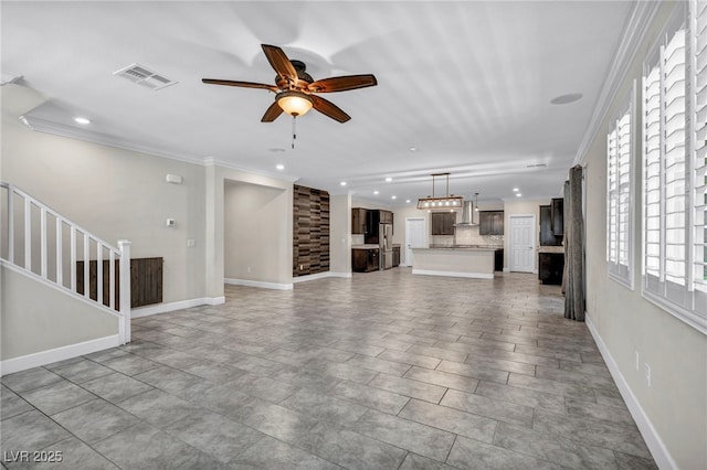 unfurnished living room featuring crown molding and ceiling fan