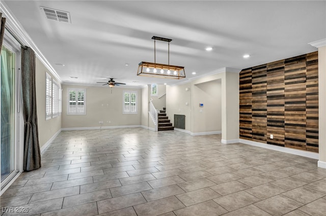 unfurnished living room featuring crown molding, light tile patterned floors, and ceiling fan