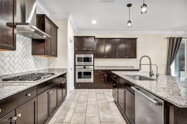 kitchen featuring sink, stainless steel appliances, light stone countertops, decorative light fixtures, and wall chimney exhaust hood