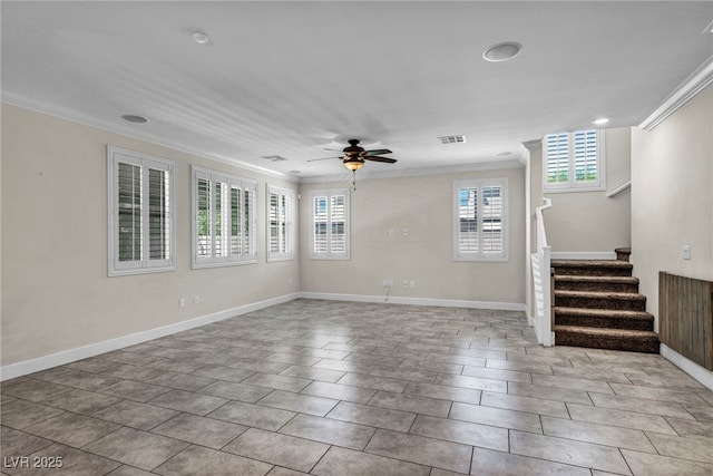 empty room with ornamental molding and plenty of natural light