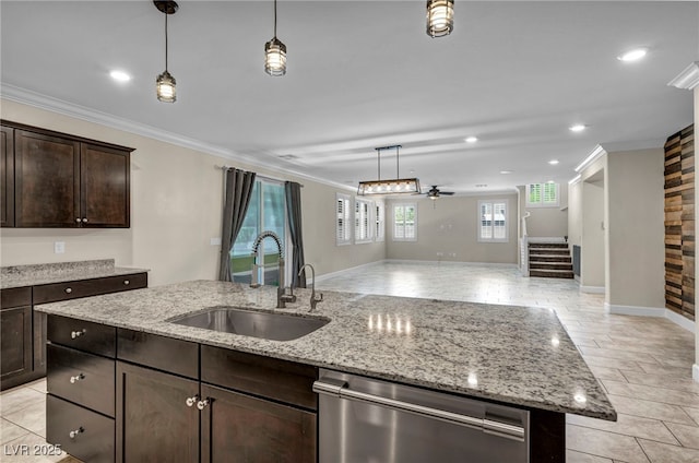 kitchen with dark brown cabinets, sink, stainless steel dishwasher, and light stone counters