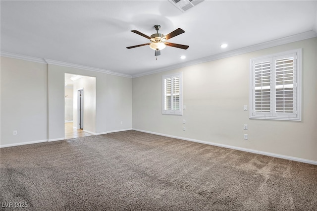 carpeted empty room with ceiling fan and ornamental molding