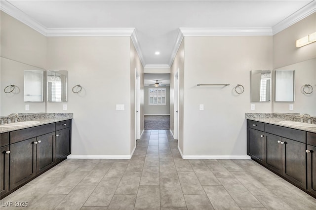 bathroom with crown molding, ceiling fan, and vanity