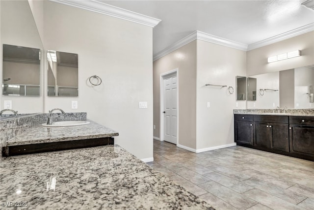 bathroom featuring ornamental molding and vanity