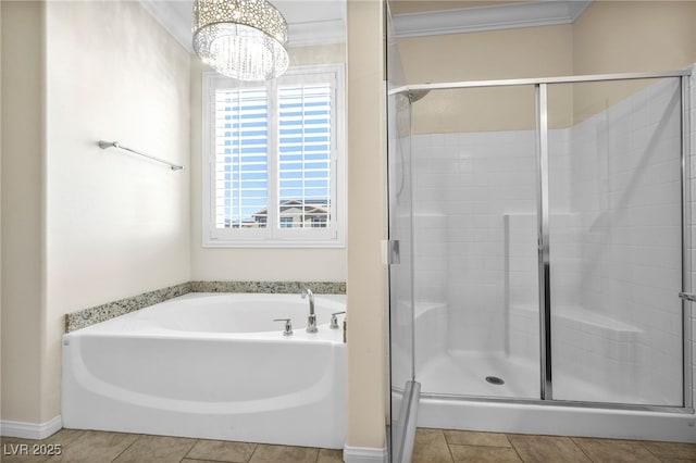 bathroom featuring crown molding, tile patterned floors, plus walk in shower, and an inviting chandelier