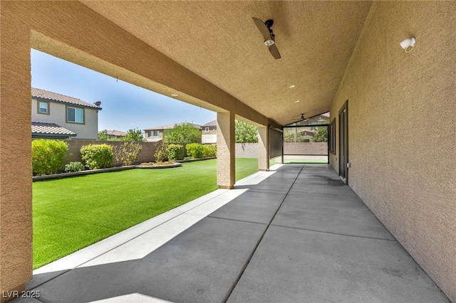 view of patio featuring ceiling fan