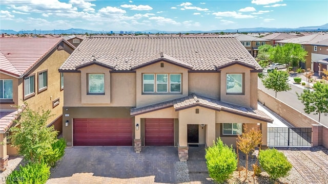 view of front of house featuring a mountain view and a garage