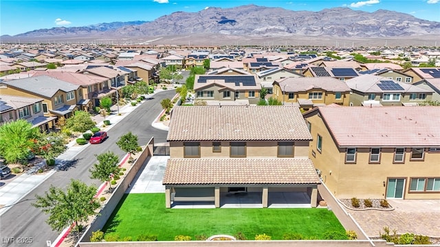 birds eye view of property with a mountain view