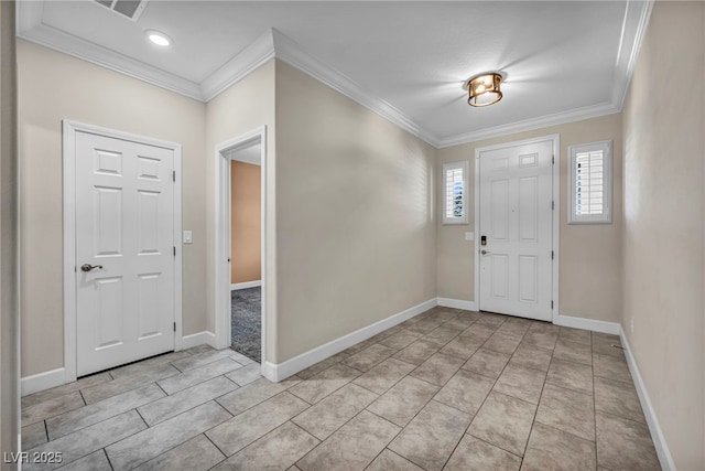 entrance foyer featuring ornamental molding and light tile patterned floors