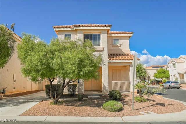 mediterranean / spanish-style house with covered porch