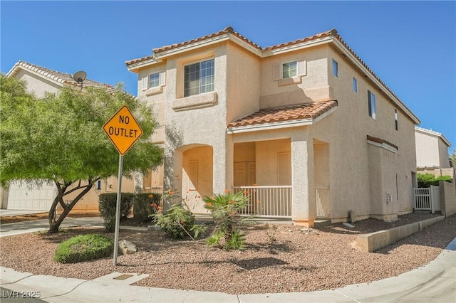 mediterranean / spanish home with covered porch