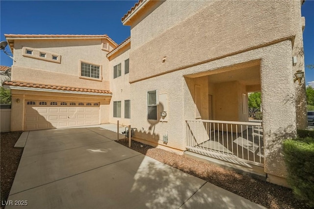 rear view of property with a garage