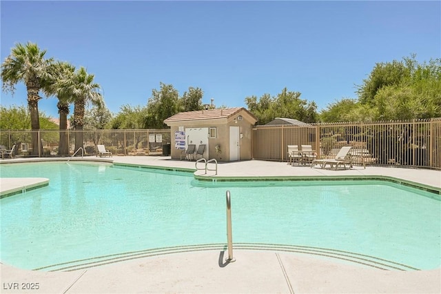 view of swimming pool featuring a patio area