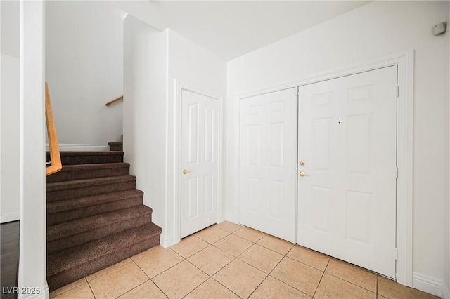 foyer entrance featuring light tile patterned floors