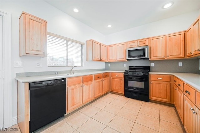 kitchen with sink, light tile patterned floors, light brown cabinets, and black appliances