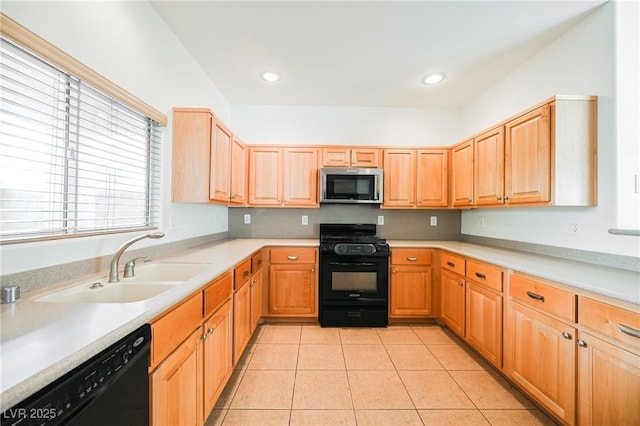 kitchen featuring light tile patterned floors, sink, and black appliances