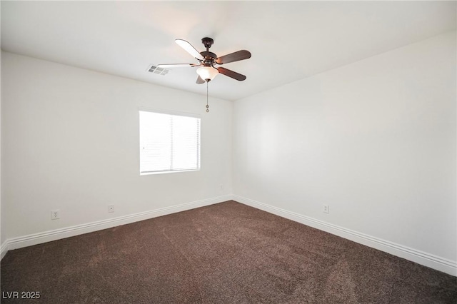 spare room featuring ceiling fan and carpet flooring