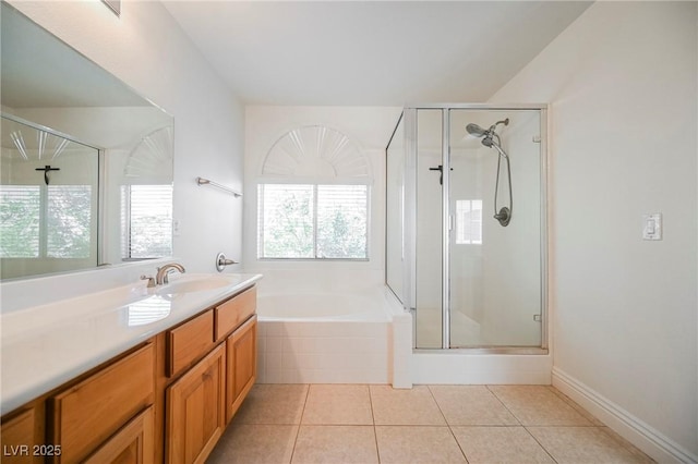 bathroom featuring vanity, plus walk in shower, and tile patterned flooring