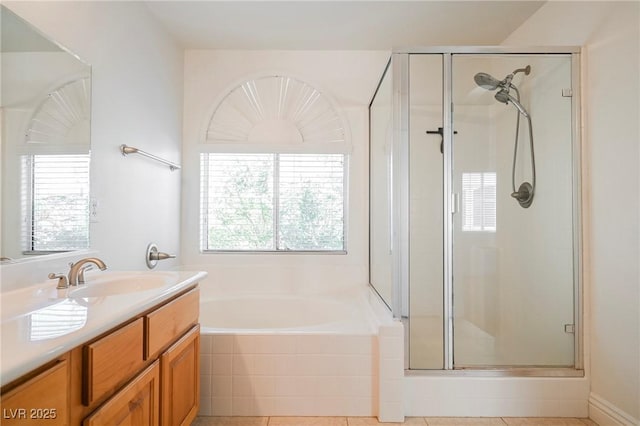 bathroom with vanity and independent shower and bath