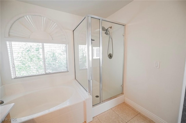 bathroom with tile patterned flooring, vanity, and separate shower and tub