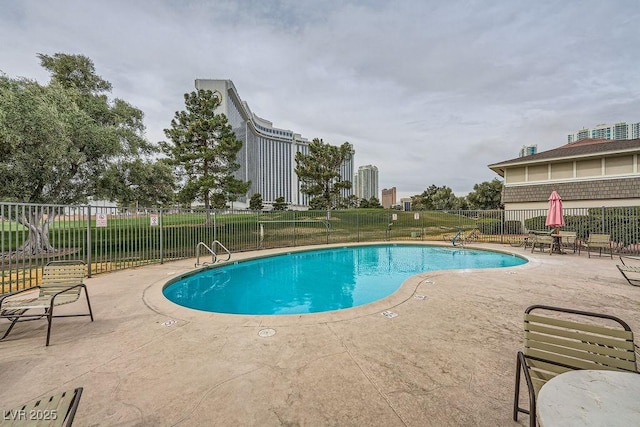 view of swimming pool with a patio area