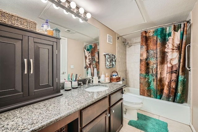 full bathroom featuring vanity, a textured ceiling, tile patterned floors, and toilet