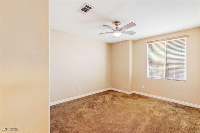 empty room featuring ceiling fan and carpet flooring