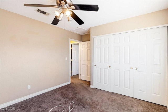 unfurnished bedroom featuring a closet, ceiling fan, and dark colored carpet