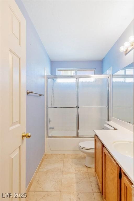 full bathroom with bath / shower combo with glass door, vanity, and toilet