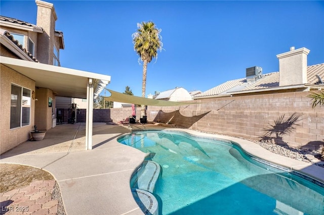 view of swimming pool featuring a patio area and central air condition unit