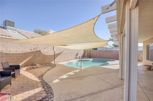 view of swimming pool featuring central AC unit and a patio