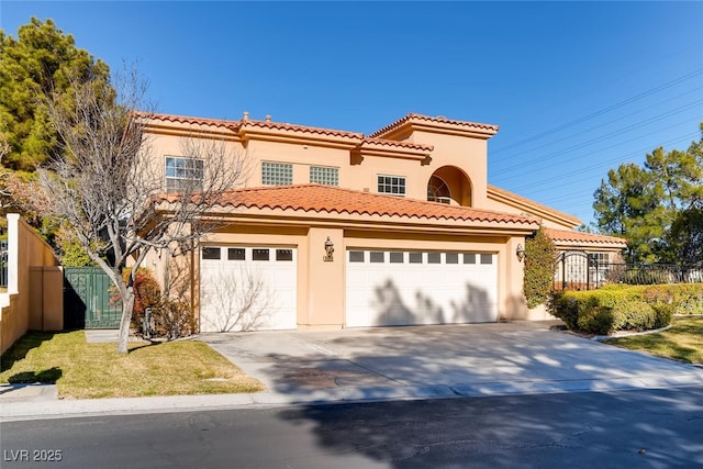 mediterranean / spanish house with a garage