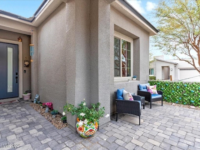 doorway to property featuring a patio