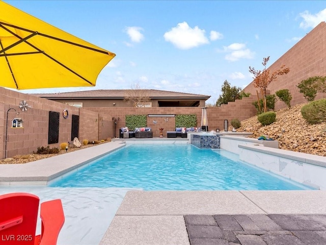 view of pool featuring pool water feature and a jacuzzi