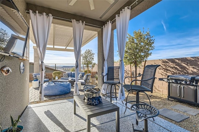 view of patio / terrace with area for grilling, a pergola, and ceiling fan