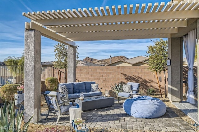 view of patio with an outdoor living space and a pergola