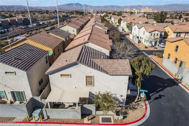 birds eye view of property featuring a mountain view