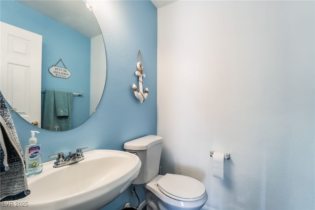 bathroom with sink and toilet