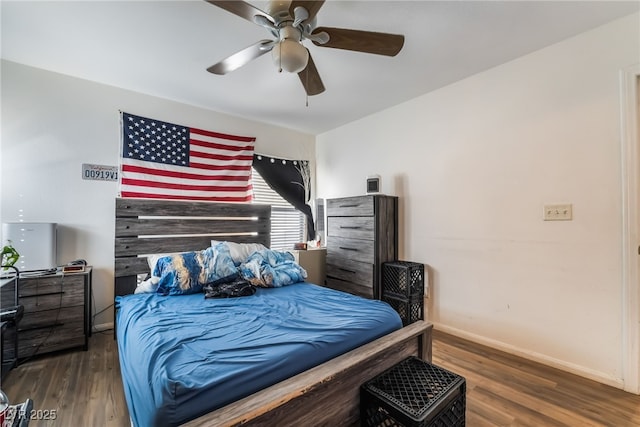 bedroom with ceiling fan and dark hardwood / wood-style flooring