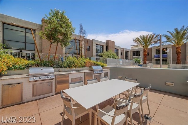 view of patio featuring a grill and exterior kitchen