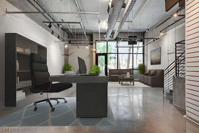 office area featuring concrete flooring