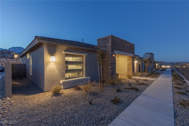 view of property exterior at dusk