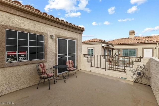 view of patio / terrace with a balcony