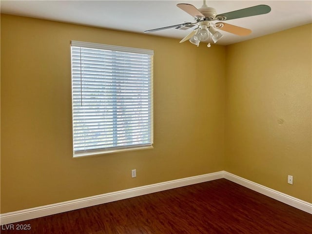 empty room featuring wood-type flooring and ceiling fan