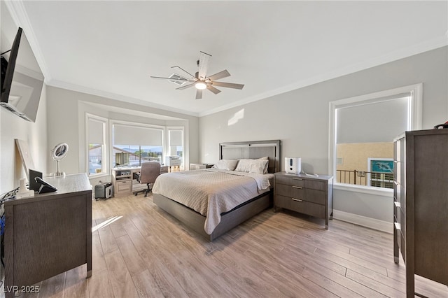 bedroom featuring ornamental molding, ceiling fan, and light hardwood / wood-style floors