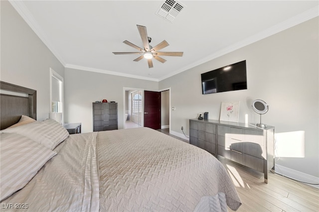 bedroom with ceiling fan, ornamental molding, and light hardwood / wood-style flooring