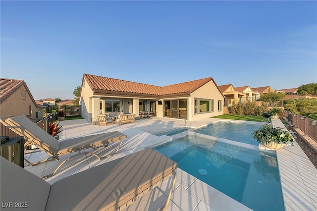 view of swimming pool with a patio and an in ground hot tub