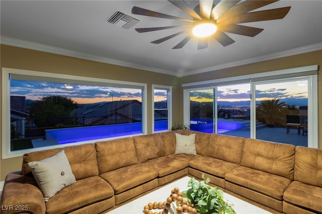 living room featuring crown molding and ceiling fan