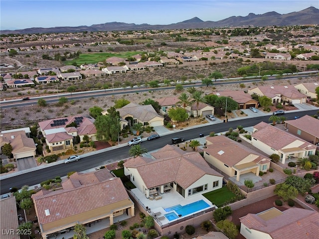 drone / aerial view featuring a mountain view